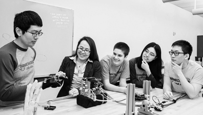 Associate Professor Veronica J. Santos and her biomechatronics laboratory team discuss techniques for teleoperating
artificial hands in human-machine systems.