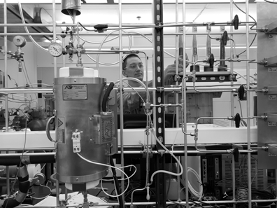 Assistant professor Dante A. Simonetti sets up a packed bed reactor.