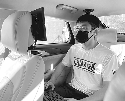 Mobility Lab team member Xu Han prepares an automated vehicle