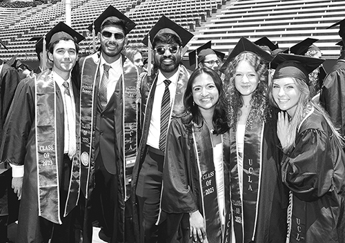 engineering students pose after graduation ceremonies