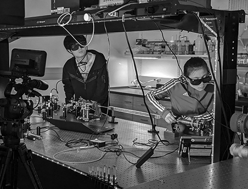 students working with lasers