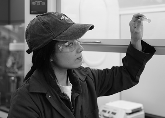 student with sample tube