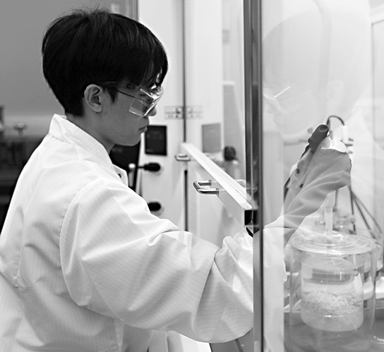 graduate student preparing sample